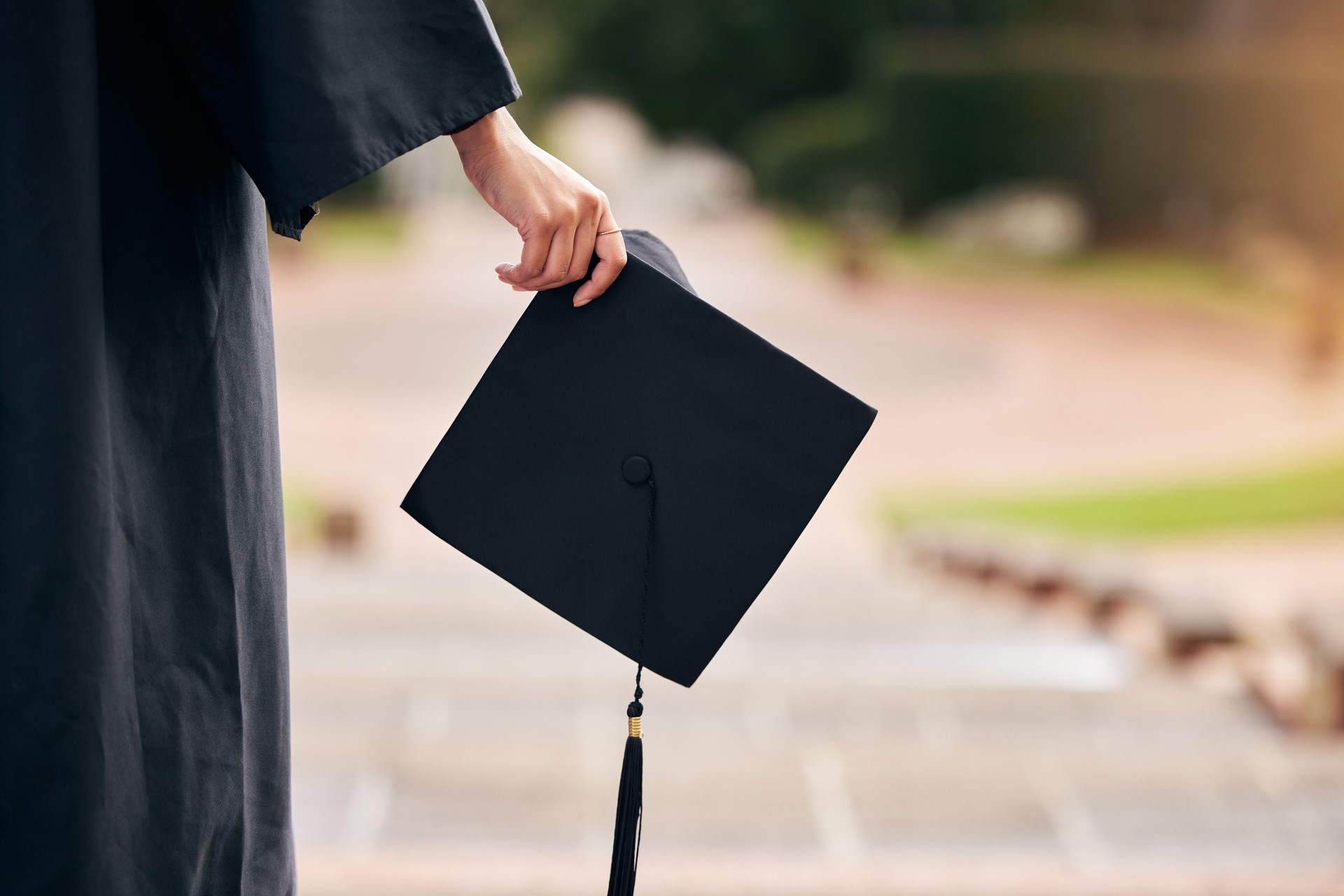 Cropped shot of an unrecognizable young female student celebrating on graduation day